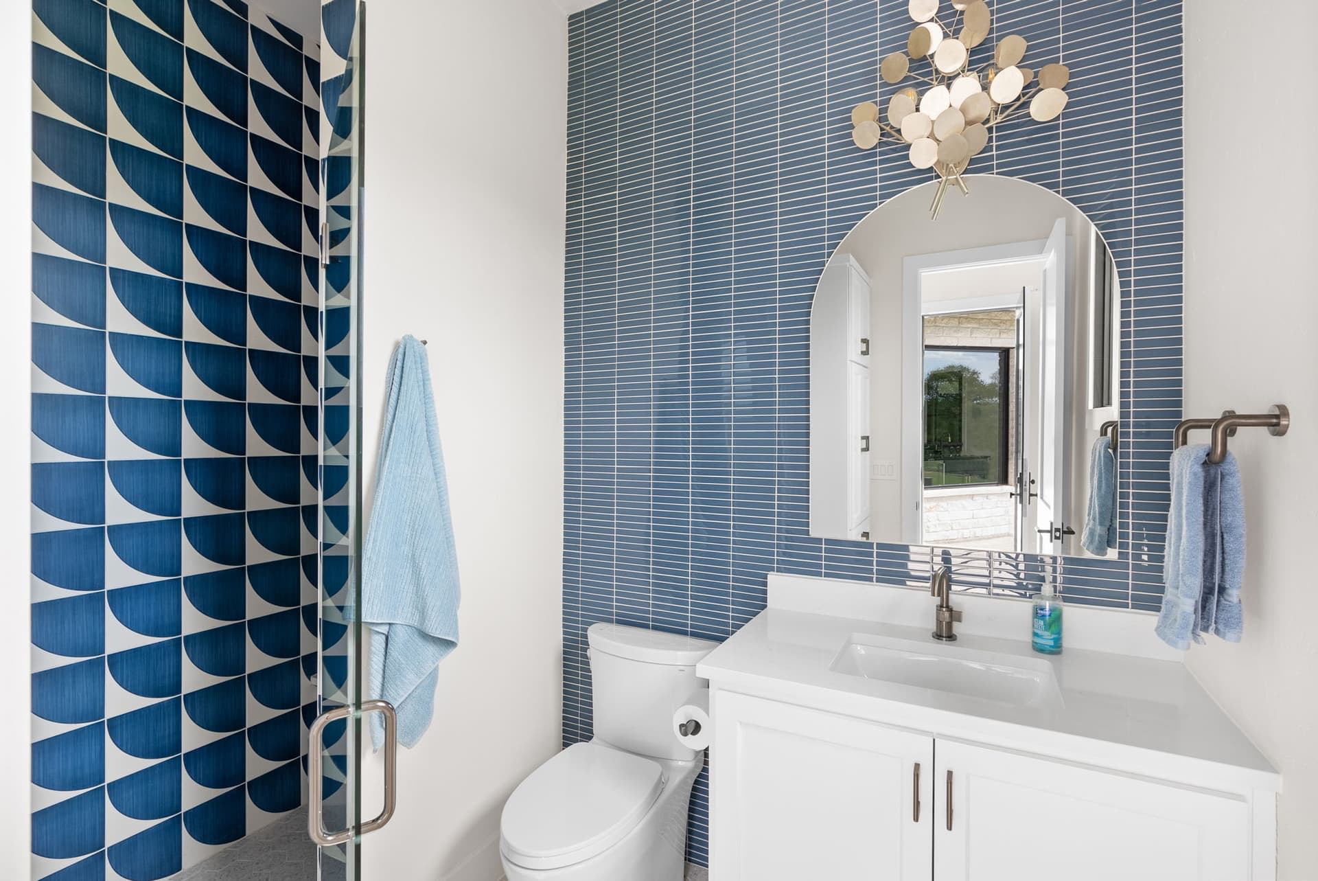 Bathroom with Blue Tile Accent Wall - Sun Tile Corporation