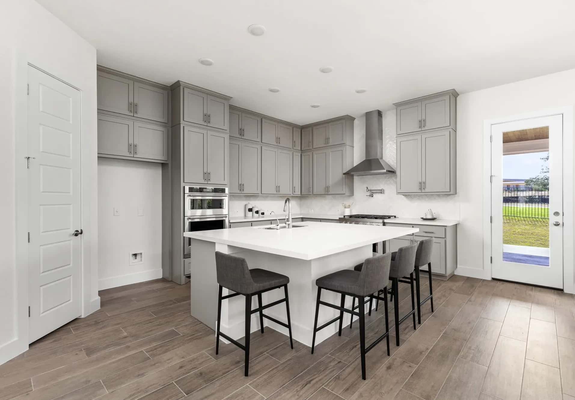 Kitchen with wood tile and tile backsplash